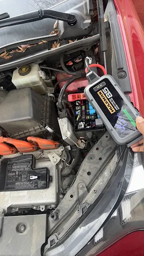 Jump starting a car battery with a portable jump starter pack in Maryland